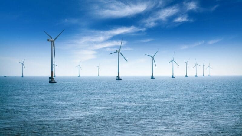 Photo of an array of offshore wind turbines