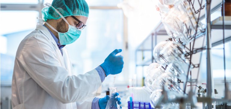 Image of lab technician and bottles